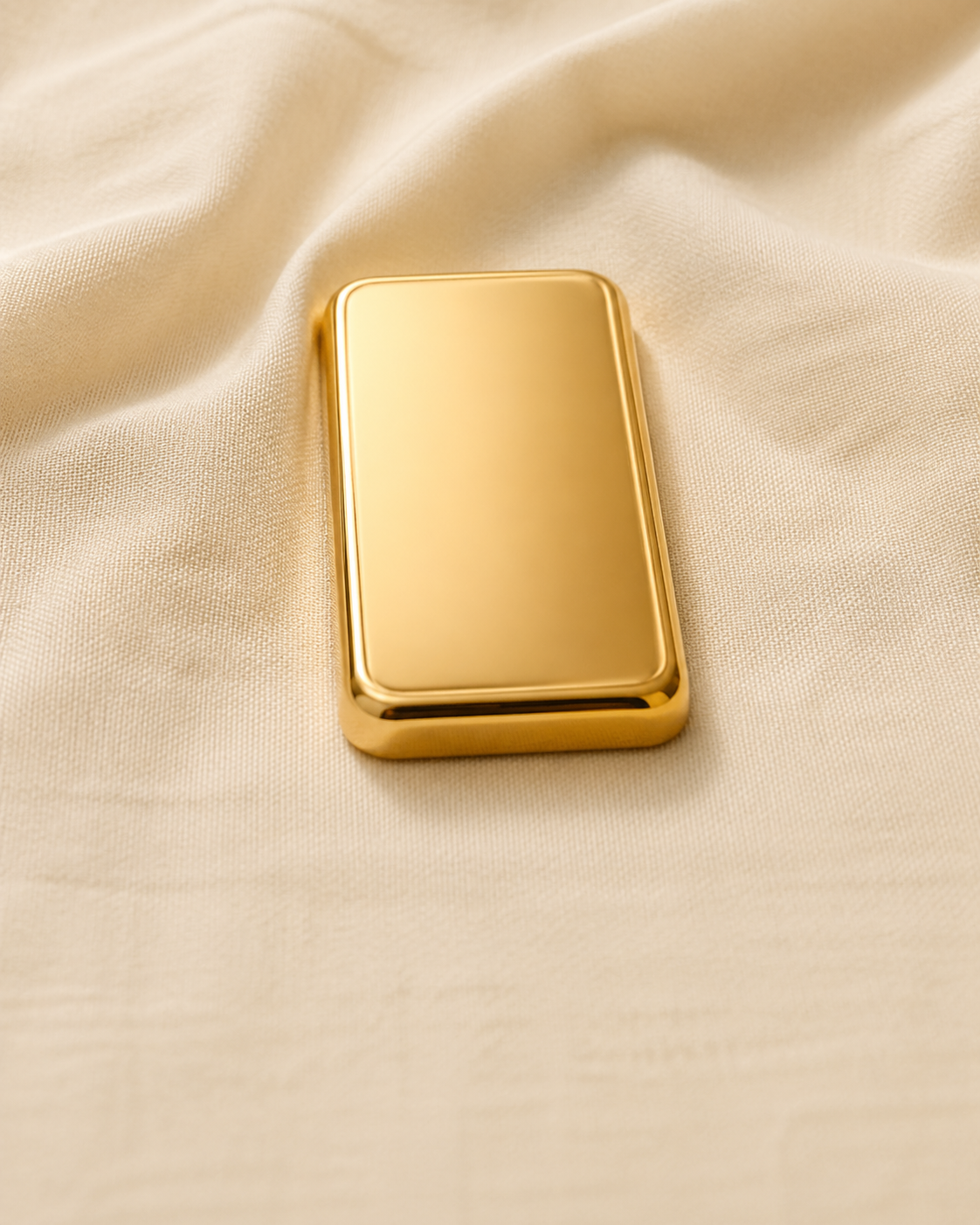 product shot · single 1oz gold bar on warm cream linen, soft top-light